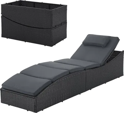 A black rattan sun lounger with gray cushions and a separate black rattan storage box are shown against a white background.