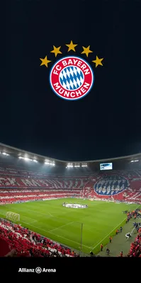 A football stadium at night with the FC Bayern München logo above.