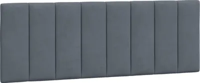 A dark gray upholstered headboard with vertical stitching.