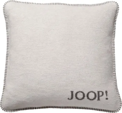 A plain white background with a single pillow.