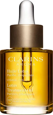 A product shot of a Clarins Lotus Treatment Oil bottle.