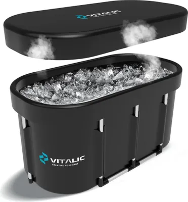 A black ice bath tub filled with ice and water, with its lid slightly ajar, showing steam rising.