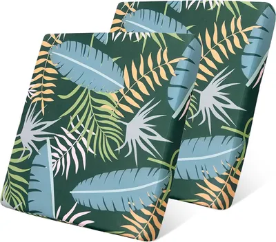Two cushion covers with a tropical leaf pattern are shown.