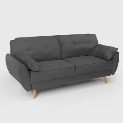 A dark gray sofa with wooden legs against a light gray background.
