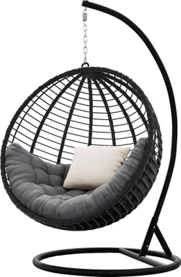 A black hanging egg chair with dark gray cushions and a beige pillow, presented against a white background.