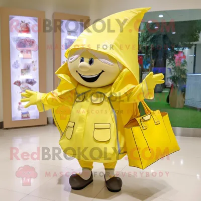 Zdjęcie produktu dla Cytrynowożółta REDBROKOLY postać w kostiumie maskotki zębowej wróżki ubrana w płaszcz przeciwdeszczowy i torebki