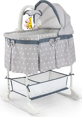 A baby bassinet with a mobile and storage basket.