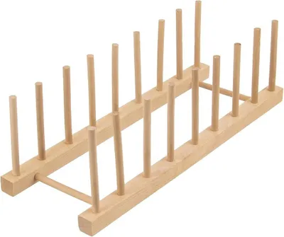 A wooden dish rack or plate holder with multiple slots.