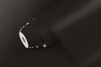A roll of black matte adhesive film.