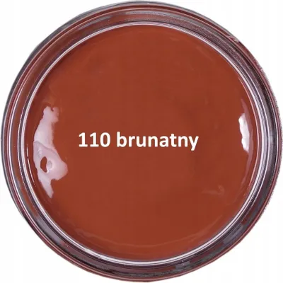 A top-down view of a jar of brown shoe cream.