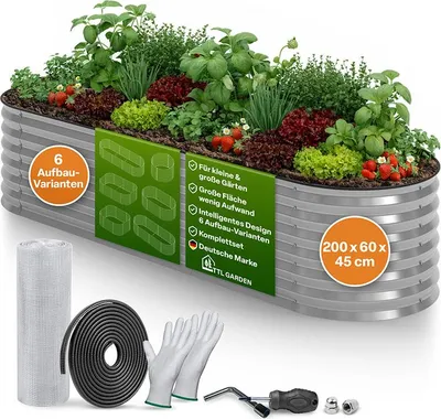 A raised garden bed filled with plants, along with gardening accessories.