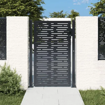 A modern garden gate made of steel with a perforated design, set between two white brick pillars.