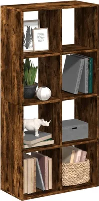 A tall, narrow bookshelf with eight cube-shaped compartments, filled with various decorative items and books.