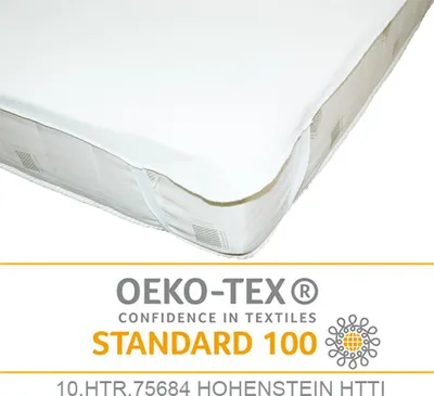 A close-up view of a mattress protector on a mattress, with a certification logo below.