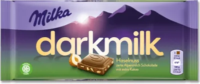 A Milka darkmilk chocolate bar with hazelnuts.