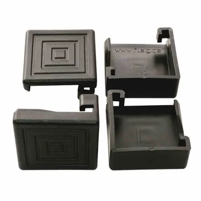 Four black plastic corner protectors for table and bench legs.