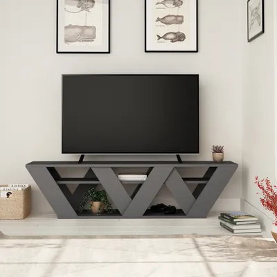 A modern living room with a TV stand and television.