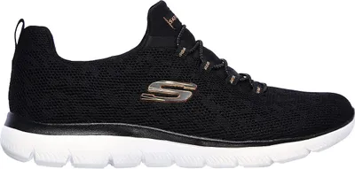 A side view of a black Skechers sneaker with a white sole.