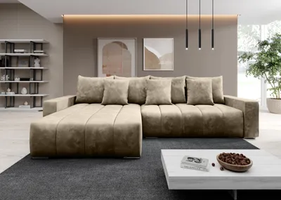 A modern living room with a large sectional sofa, coffee table, and artwork on the wall.