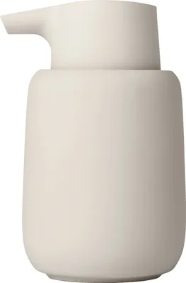 A white soap dispenser is shown against a white background.