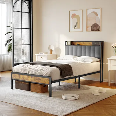 A bedroom scene featuring a bed with a headboard, nightstands, and artwork on the wall.