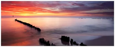 Produktbild von Wallario Wandbild aus Acryl, 200 x 80 cm, freischwebende Optik - Sandstrand im Sonnenuntergang - Roter Himmel