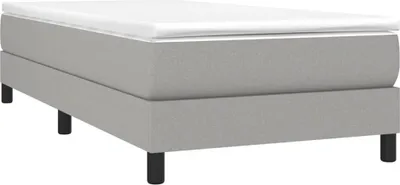 A single bed frame with a mattress topper and black legs, shown from a side angle on a white background.