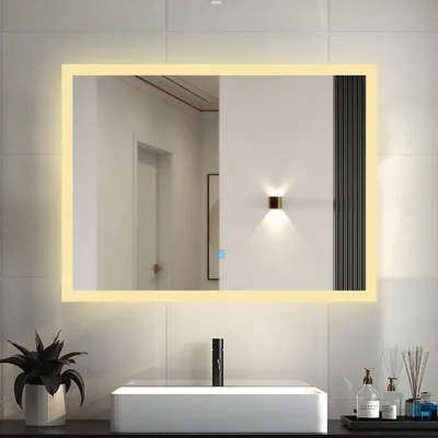 A bathroom mirror with integrated LED lighting above a sink.