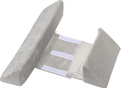 A light gray baby positioning pillow is shown against a white background.