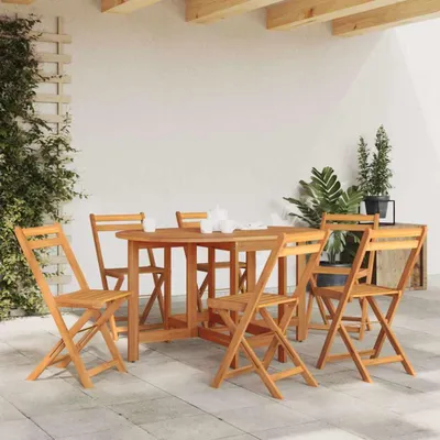 An outdoor patio setting with a wooden table and chairs.