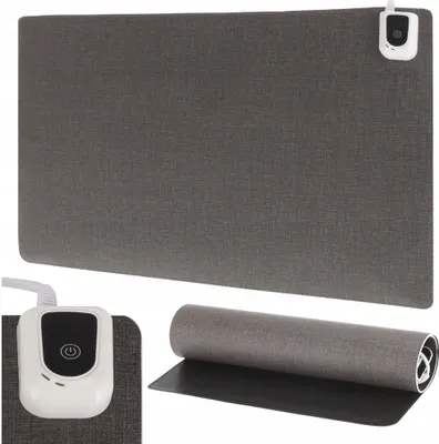 A heated desk mat and its controller are shown, along with a rolled-up mat.