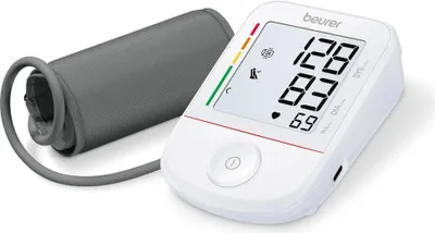 A white Beurer blood pressure monitor with a gray cuff is shown on a white background.