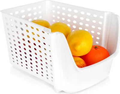 A white plastic storage container filled with fruits.
