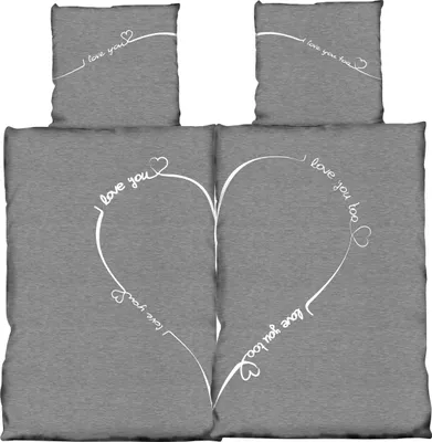 A set of bedding with a heart design and text.