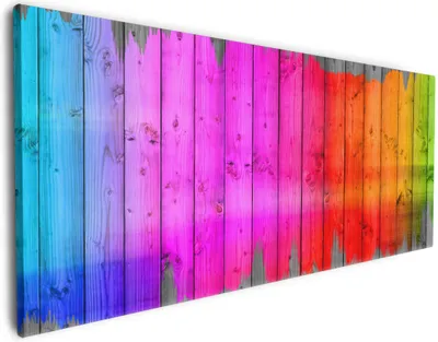 Produktbild von Wallario Premium Leinwandbild Holzpaneel - Bemaltes buntes Holz in Größe 50 x 125 cm