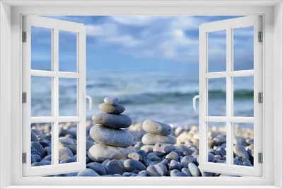 Produktbild von Wallario Poster mit Fenster-Illusion: Steinstapel am Strand, Größe: 61 x 91,5 cm (Maxiposter)