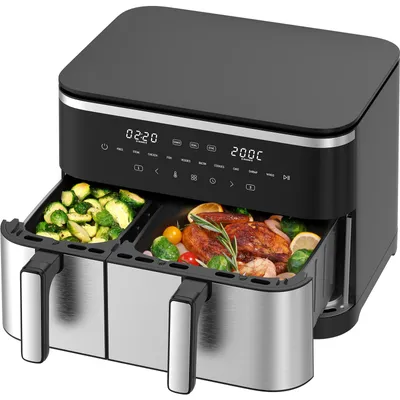 A dual-chamber air fryer with food in both baskets, placed on a white background.