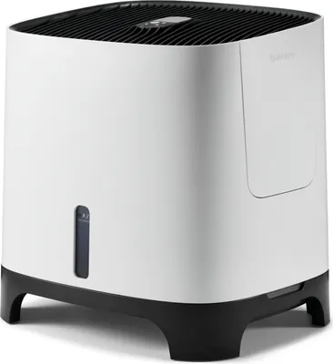 A white and black humidifier is shown from a three-quarter angle against a white background.