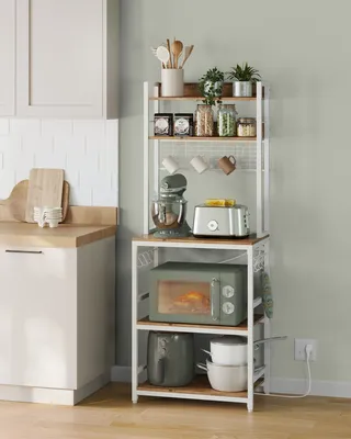 A kitchen baker's rack filled with various kitchen appliances and accessories.