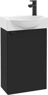 A black vanity unit with a white sink and a black faucet.