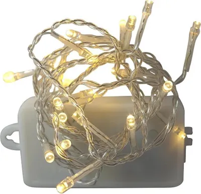 A string of warm white LED lights coiled around a white battery pack.