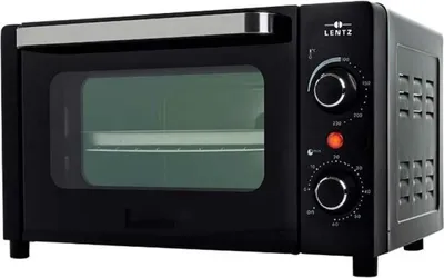 A black mini oven is shown from a front-side angle against a black background.