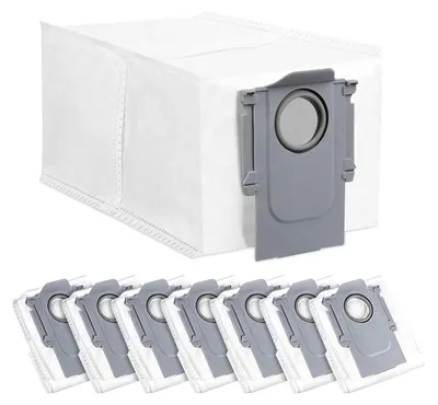 A set of vacuum cleaner dust bags and one dust bag in a docking station.