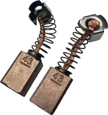 Two bronze carbon brushes with springs and metal holders, each marked with '43'.