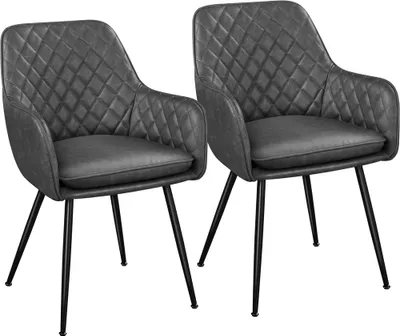 Two gray accent chairs with diamond tufting.