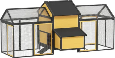 A yellow and black chicken coop with a ramp and nesting box, shown from the front.