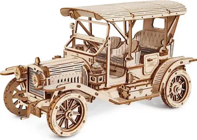 A wooden model of a vintage car.