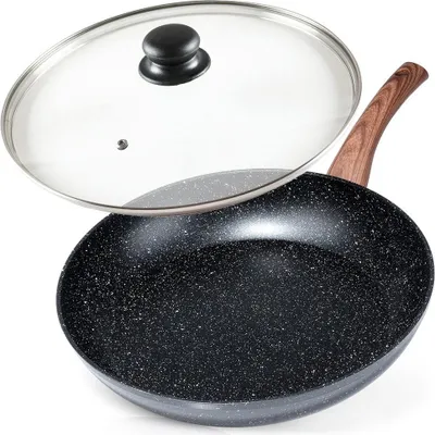 A black frying pan with a speckled surface and a wooden handle, shown with a clear glass lid slightly ajar.