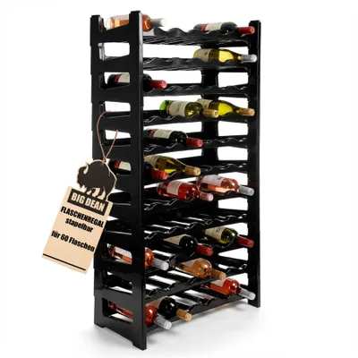 A black plastic wine rack filled with various bottles of wine, shown from a diagonal angle against a white background. A small tag is attached to the side of the rack.