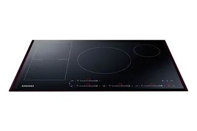 A black induction cooktop with red digital displays, shown from a slightly elevated side angle against a white background.